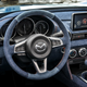 Illustration for article titled Placate Your Fears Of Global Economic Collapse With This Two-Tone Miata With A Denim Interior